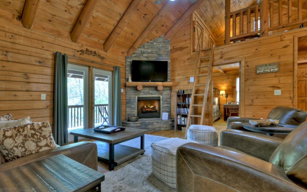 Main level living area with a seasonal gas fireplace