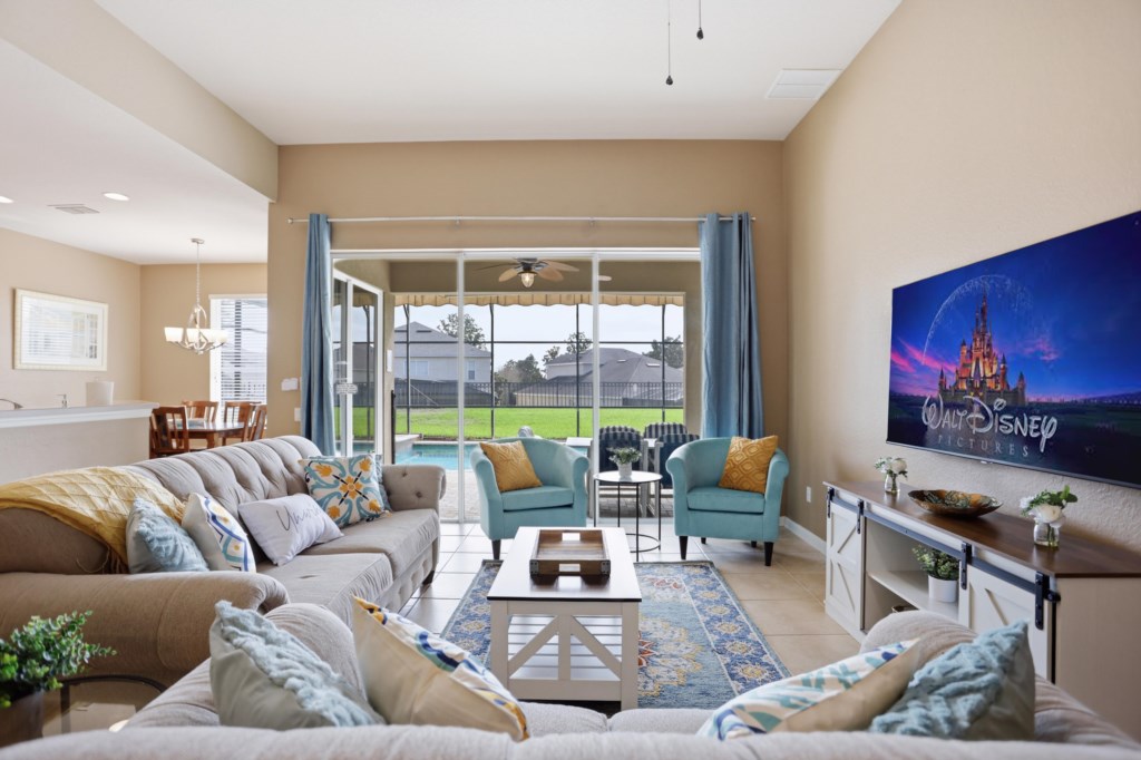 Spacious living area opens to pool patio