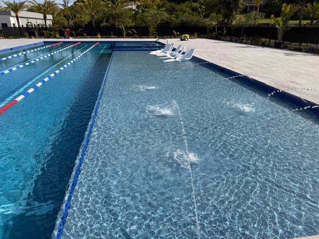 Community pool with a shallow area for lounging