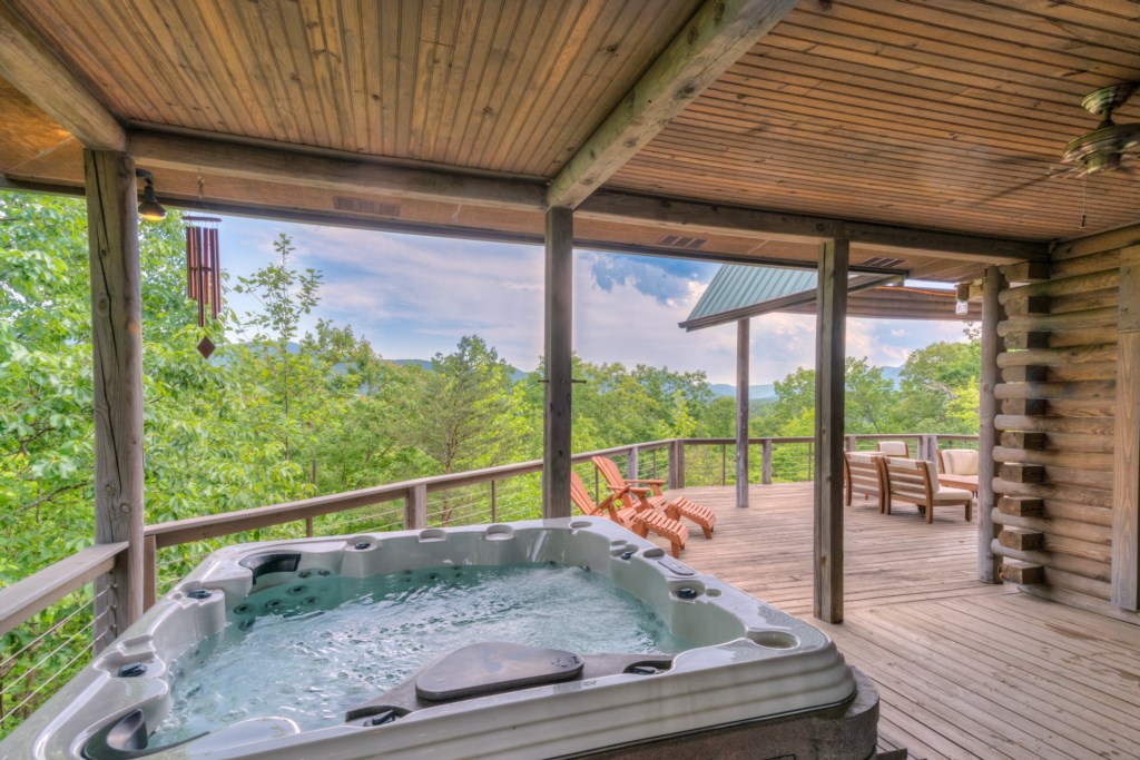 Soak in the hot tub next to amazing views!