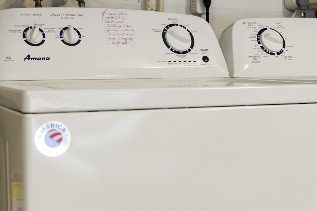 Washer and Dryer located in the garage is stocked with laundry detergent and dryer sheets.
