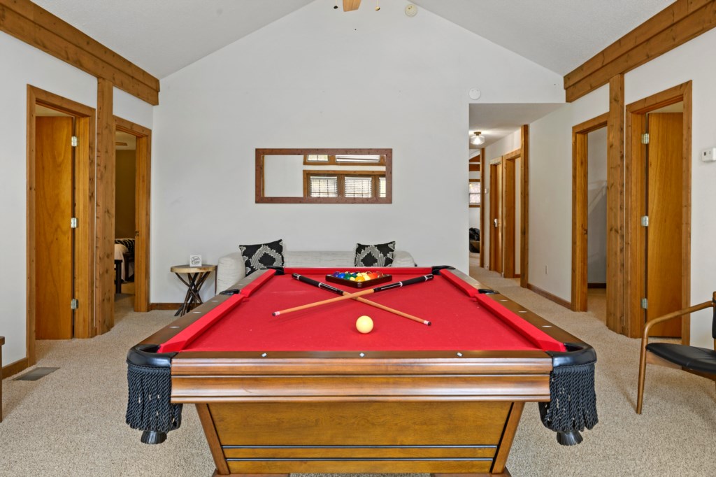 The pool room is flooded with natural light from the stunning wall of windows. 