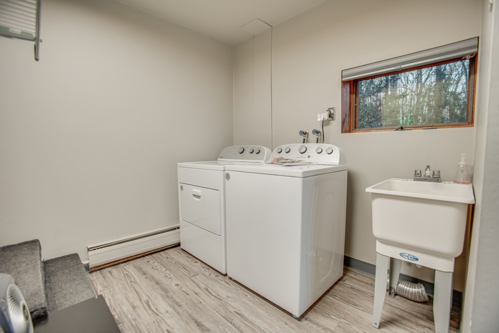 Take a few steps down to the laundry area. Detergent provided for use during your stay. 