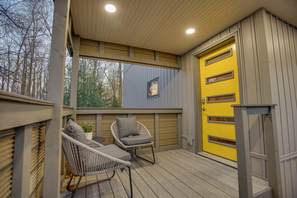 Front porch space with stunning yellow front door! 