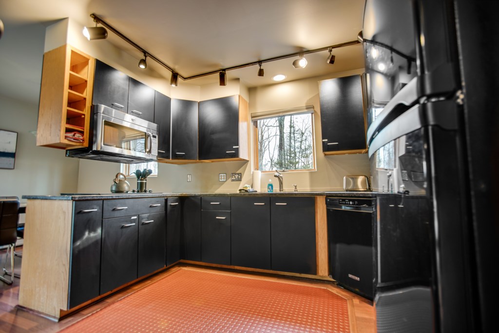 Kitchen space with rubber mat floor to avoid slipping. 