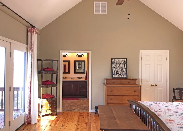 Main Level King Bedroom looking toward the Bath.  Glass doors look out to view of Green River Gorge

