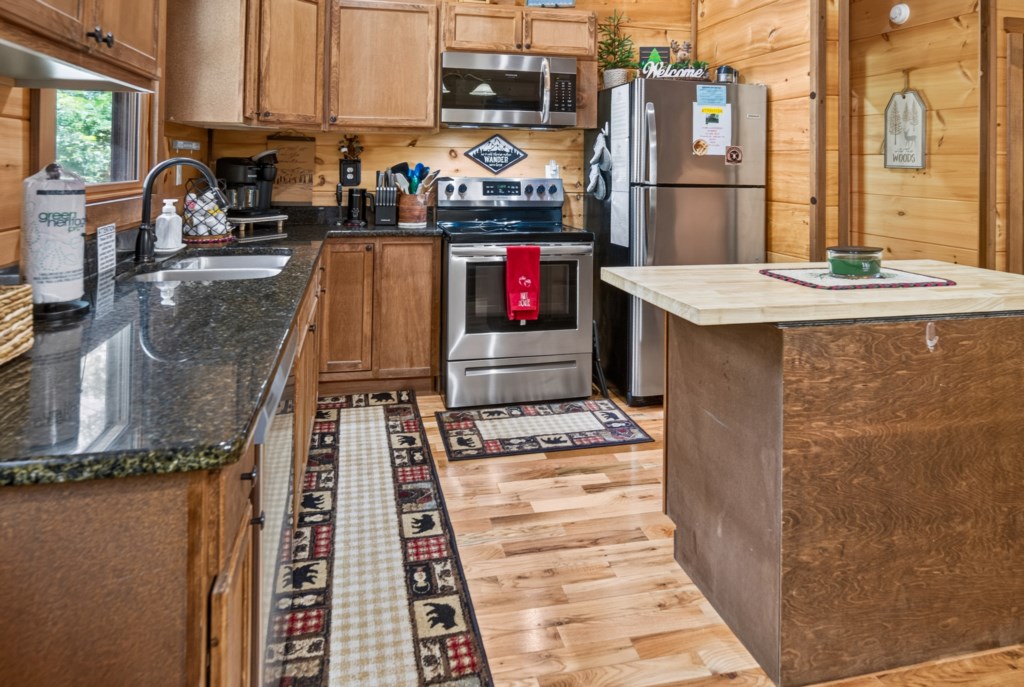 Rustic kitchen with modern appliances and ample counter space for cooking.