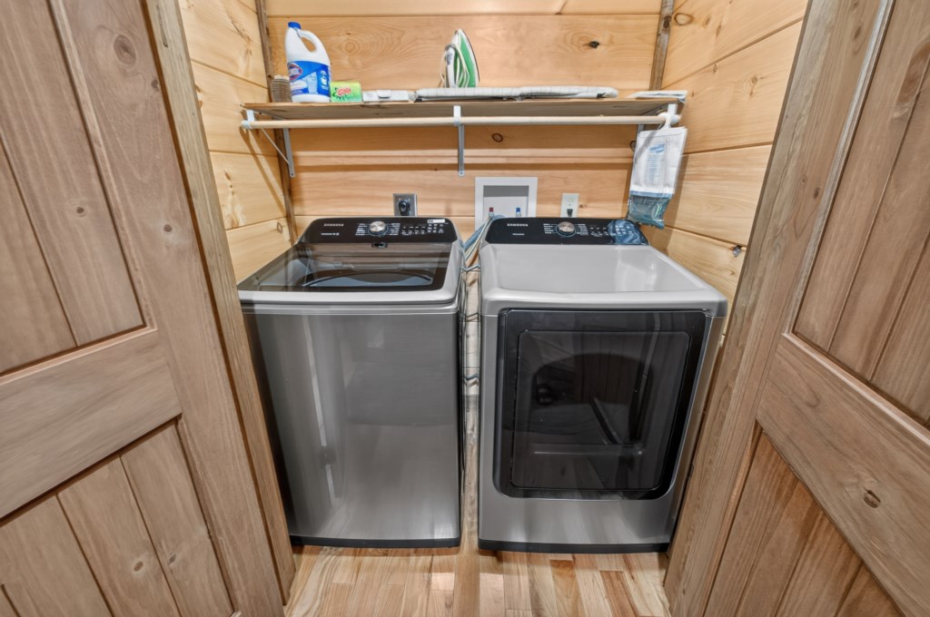 Convenient laundry room with modern washer and dryer for your extended stay.