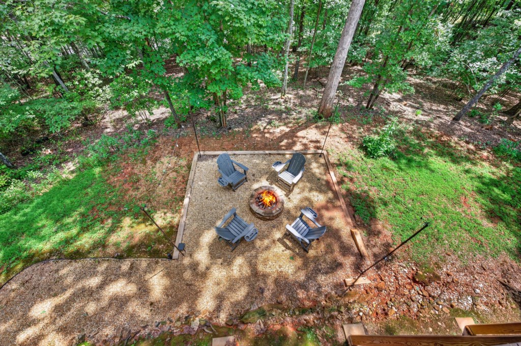 Secluded firepit area surrounded by nature, perfect for cozy evenings and stargazing.