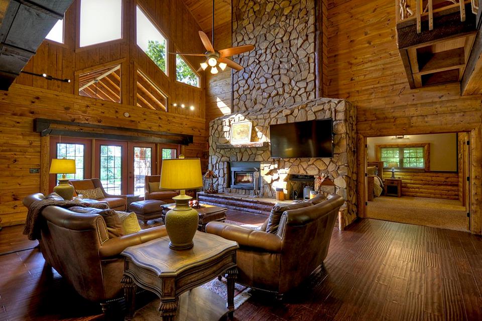 Welcome to Fox Run lodge!  Impressive Sitting Room with stone fireplace and high ceiling.