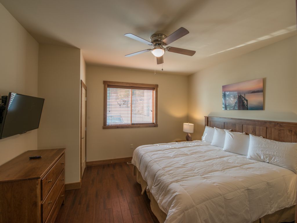 Guest room#2 featuring king size bed with 40 inch TV and luxury bedding. Equipped with custom made Amish Furniture
