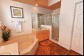 Master ensuite with corner bathtub, large walk-in shower and twin sinks