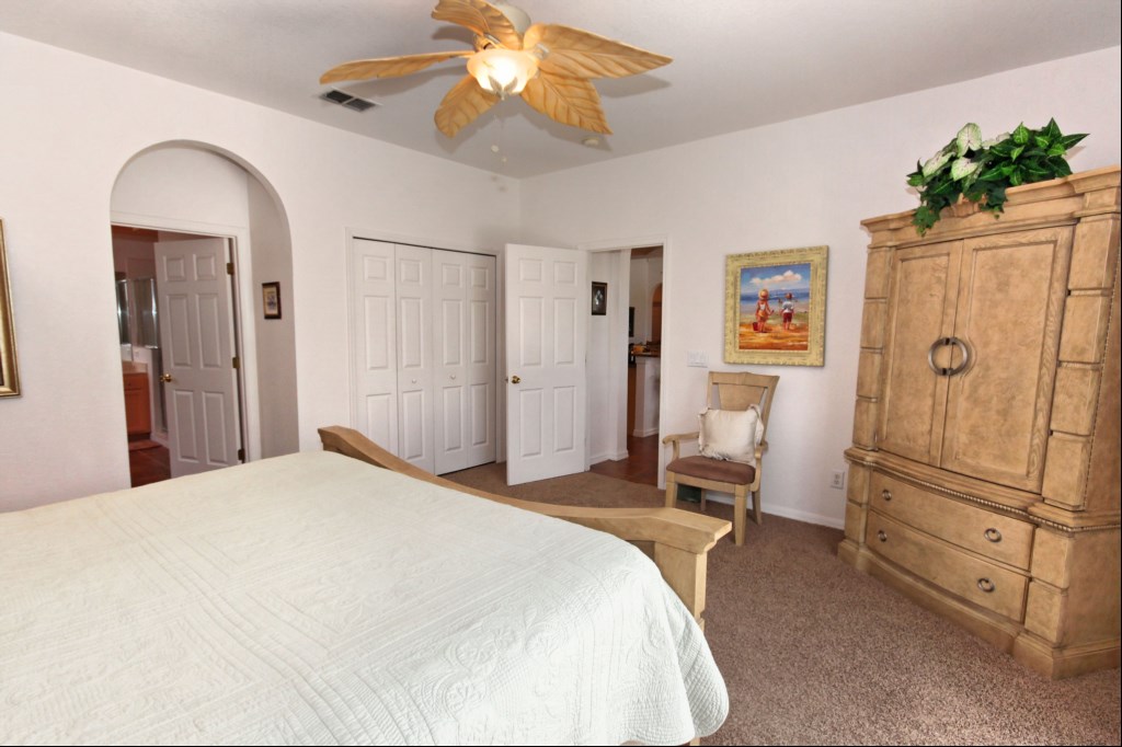 Master bedroom with direct access to pool deck - TV in cabinet