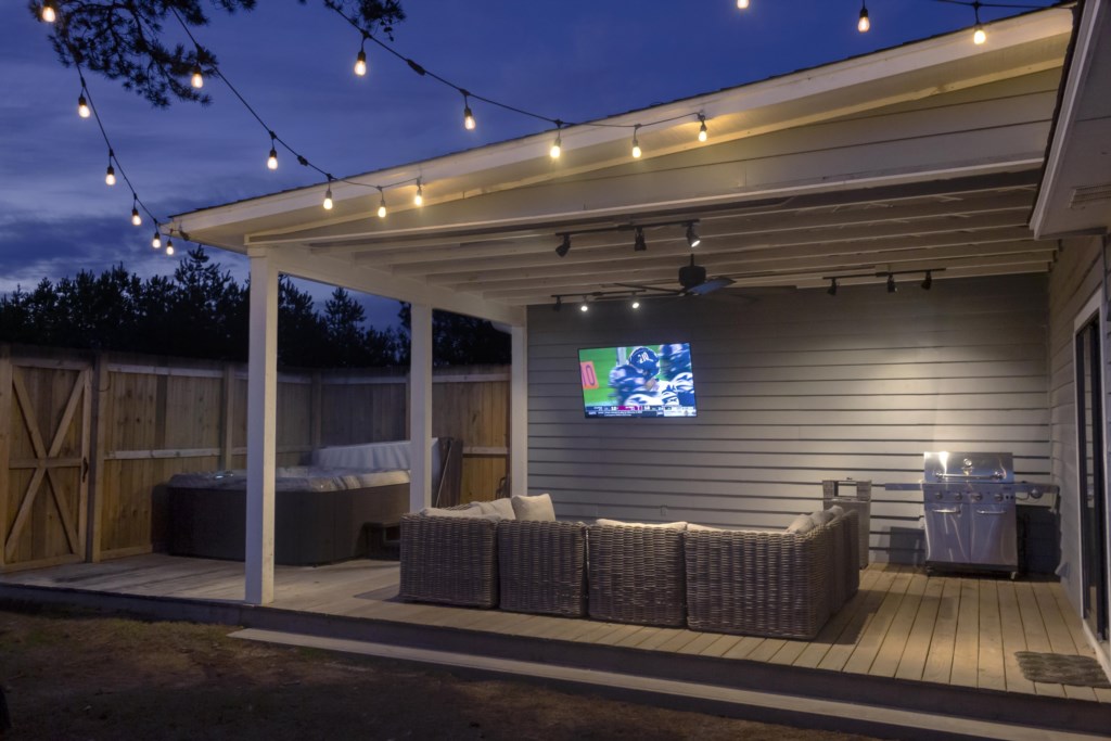 Patio living with flatscreen and couch