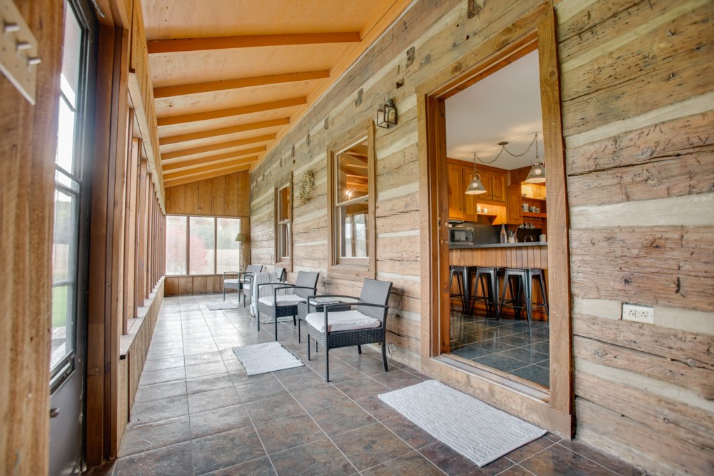Relax on the enclosed porch off the main living area. 