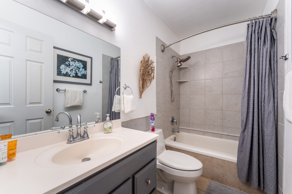 Bathroom with tub/shower combination.  Towels and beach towels are provided