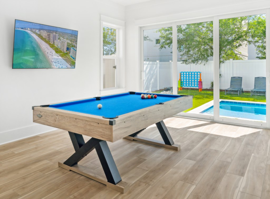 Billiards room with direct access to the pool and outdoor dining area