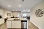 Open living runs throughout the kitchen, dining, and living areas 