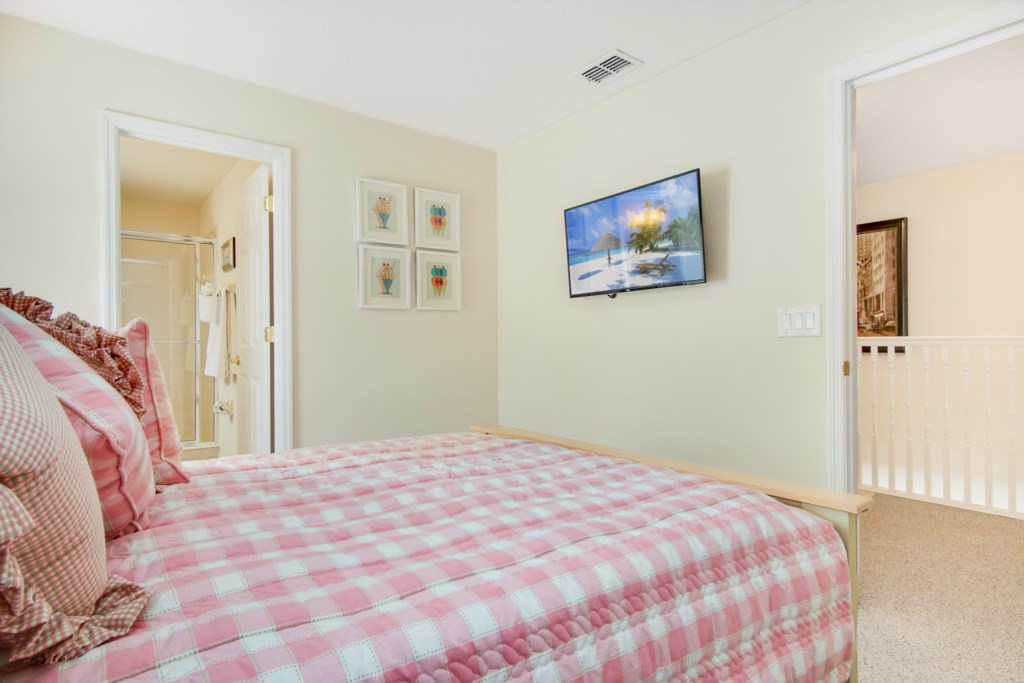 Bedroom 3 - Queen Bedroom (Pink Bedspread), 40” Private TV, En Suite Bath with Walk In Shower 