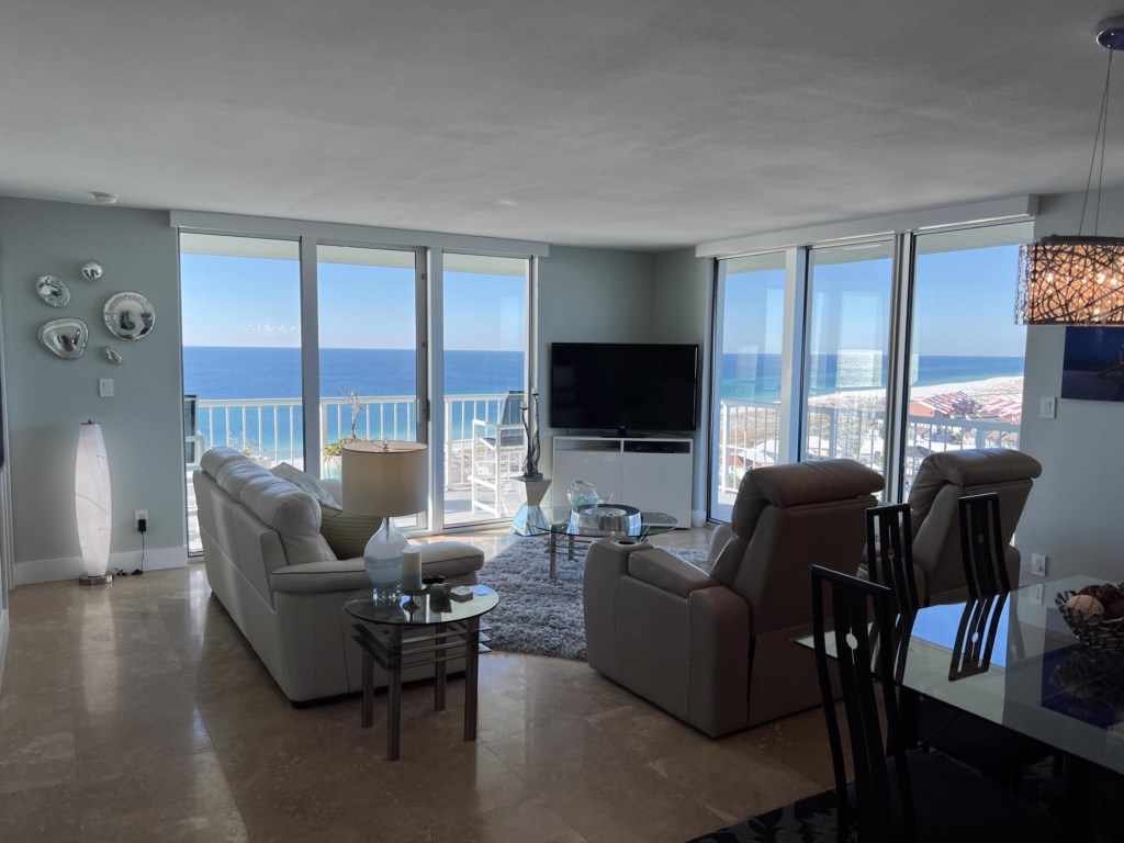 Large sliding glass doors open to the balcony from the living room.