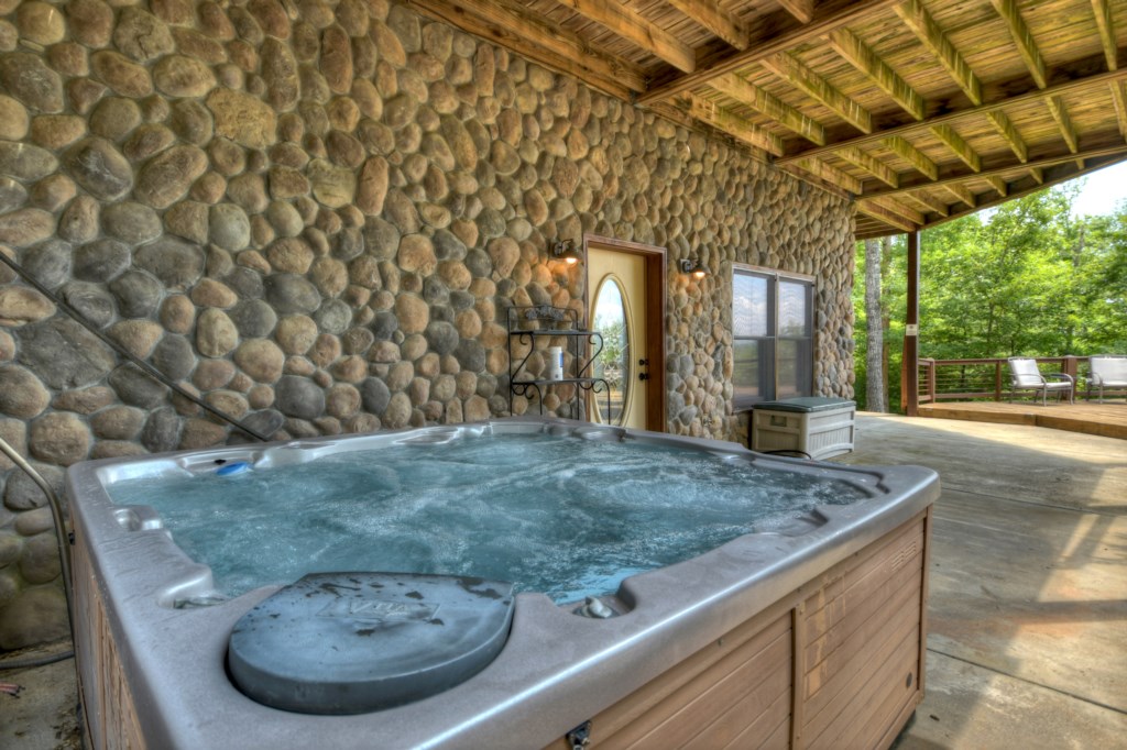 Soak all your worries away while you enjoy the hot tub in this beautiful cabin