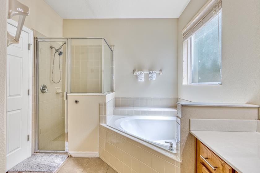Bathroom 1 - En Suite to Bedroom 1: Walk In Shower, Garden Tub, Toilet Room 