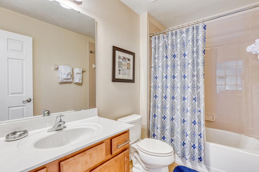 Bathroom 3 - Hallway Bathroom shared by Twin & Queen Rooms: Shower/Tub Combo, Single Sink 