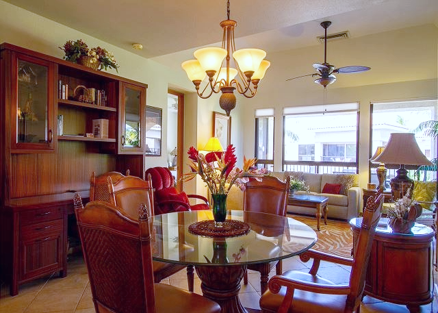 Gather around this glowing table for sunset dinners and stories, surrounded by island warmth and timeless charm.