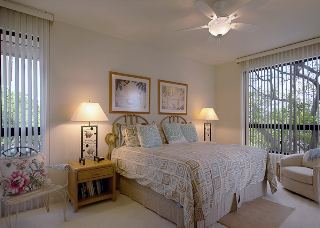 Serene bedroom with a comfortable king bed and garden views.