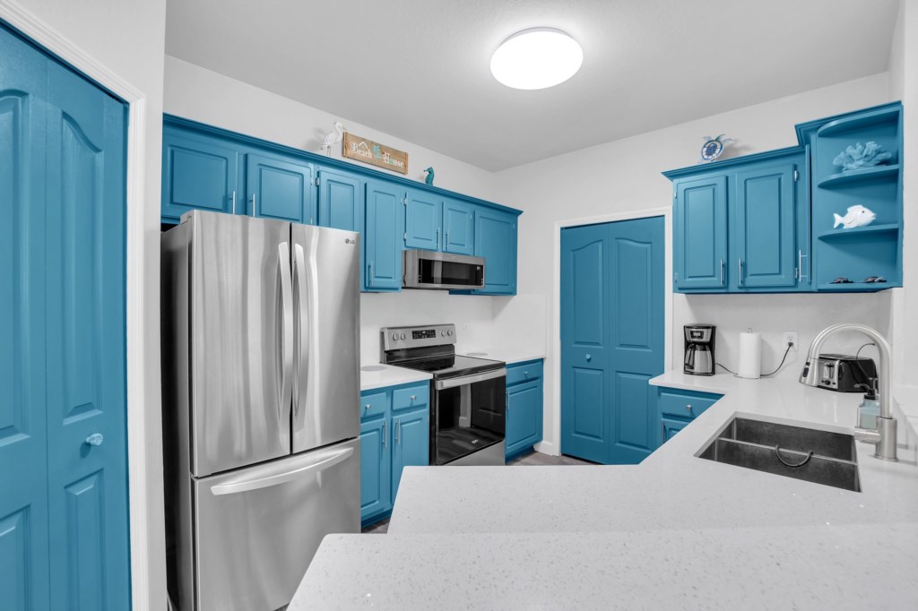 Stylishly renovated kitchen with vibrant blue cabinets