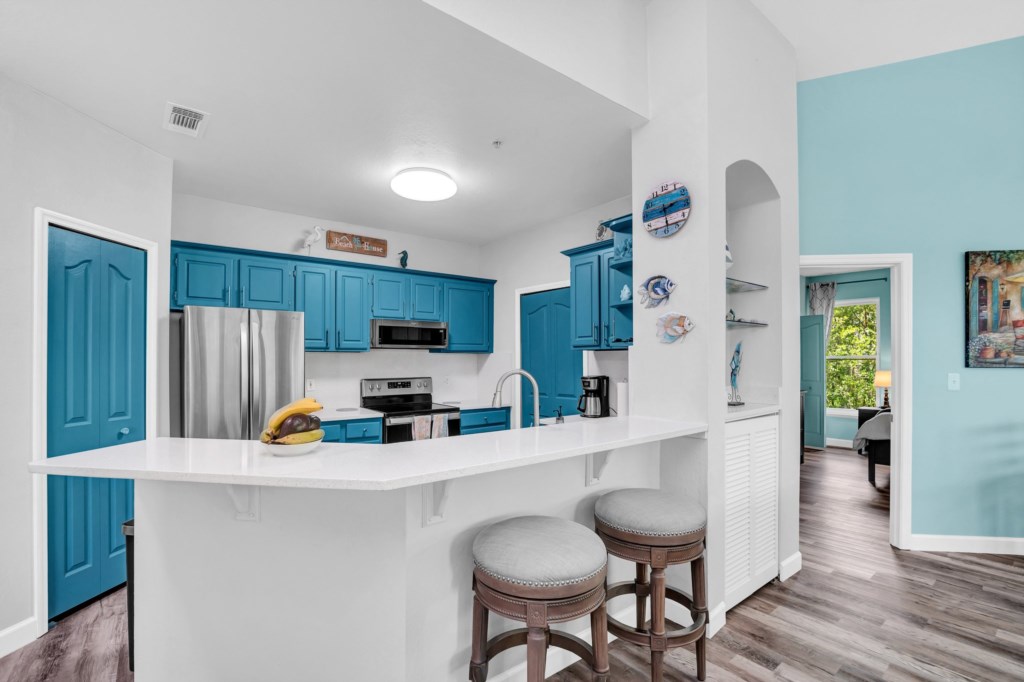 Stylishly renovated kitchen with vibrant blue cabinets
