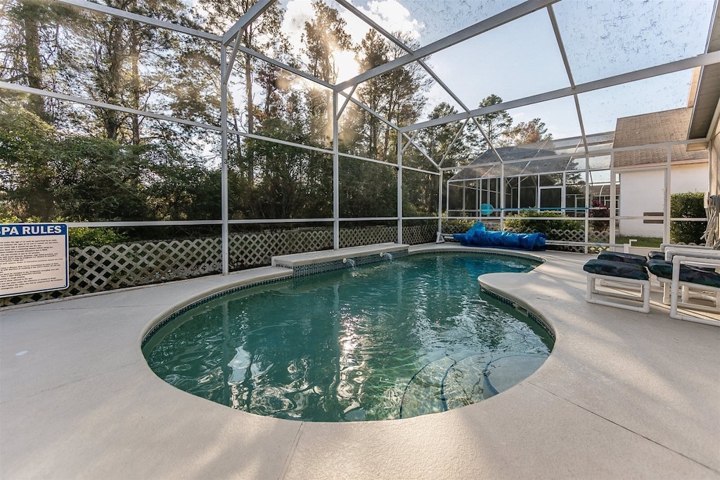 Wow!  Peaceful, private pool with view of trees and a nice lounging area. 