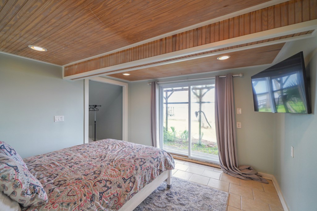 The Lower Bungalow; queen bedroom with water views, cable television, and attached bath