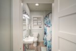 Guest bathroom with shower/tub combination; a starter supply of amenities are provided 