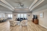 Open living room with decorative tray ceilings 