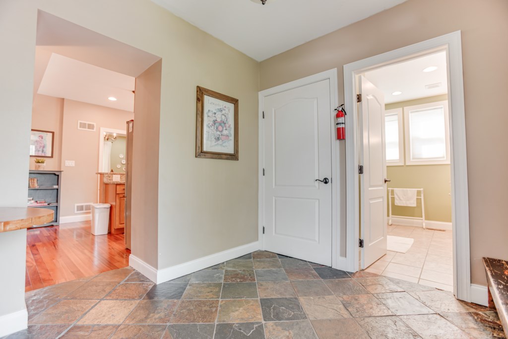 Inside front entrance accesses bathroom or kitchen and living room!
