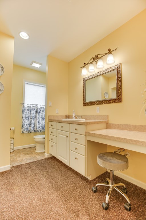 Master bathroom mirror and sink area with plenty of counter space for all of your travel toiletries. 
