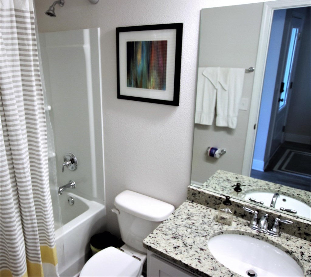 Shared bathroom with shower/tub combination; All bed and bath linens are provided 