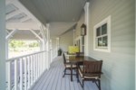 Large covered patio with ample seating and options for outdoor living 