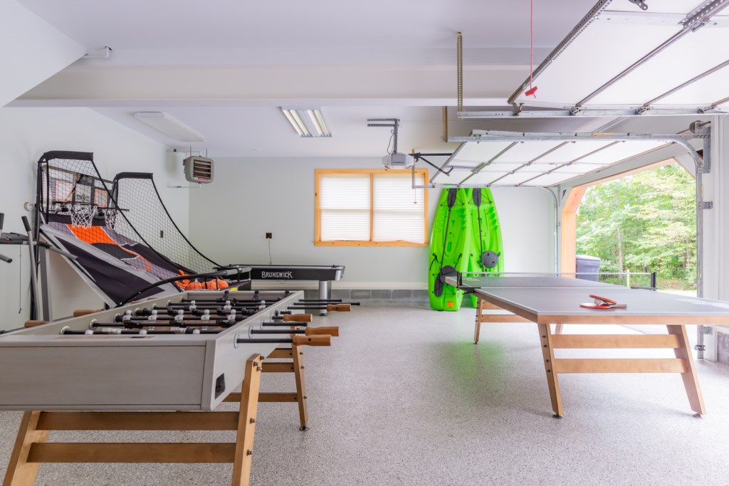 Game room in garage area with Foosball and ping Pong table