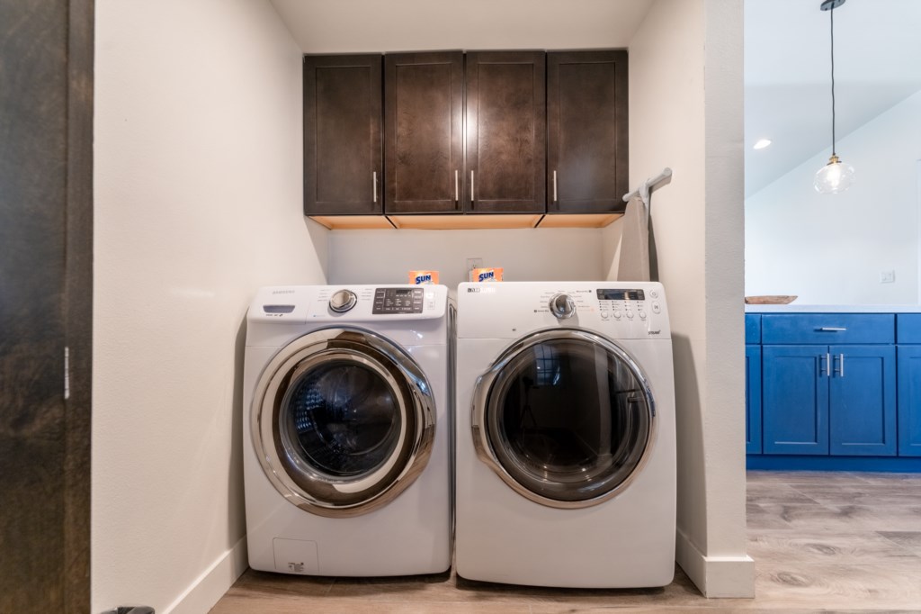 Laundry room with new washer and dryer. 