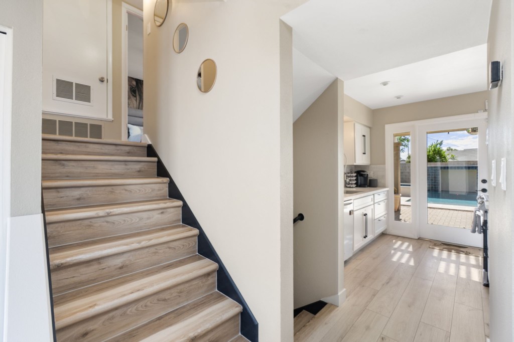 Bright entryway with pool view and easy kitchen access.