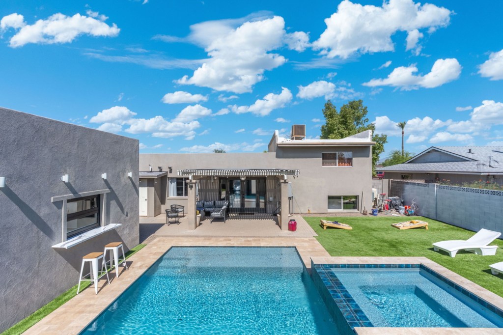 Relax by the private pool with ample seating and a convenient outdoor bar area.