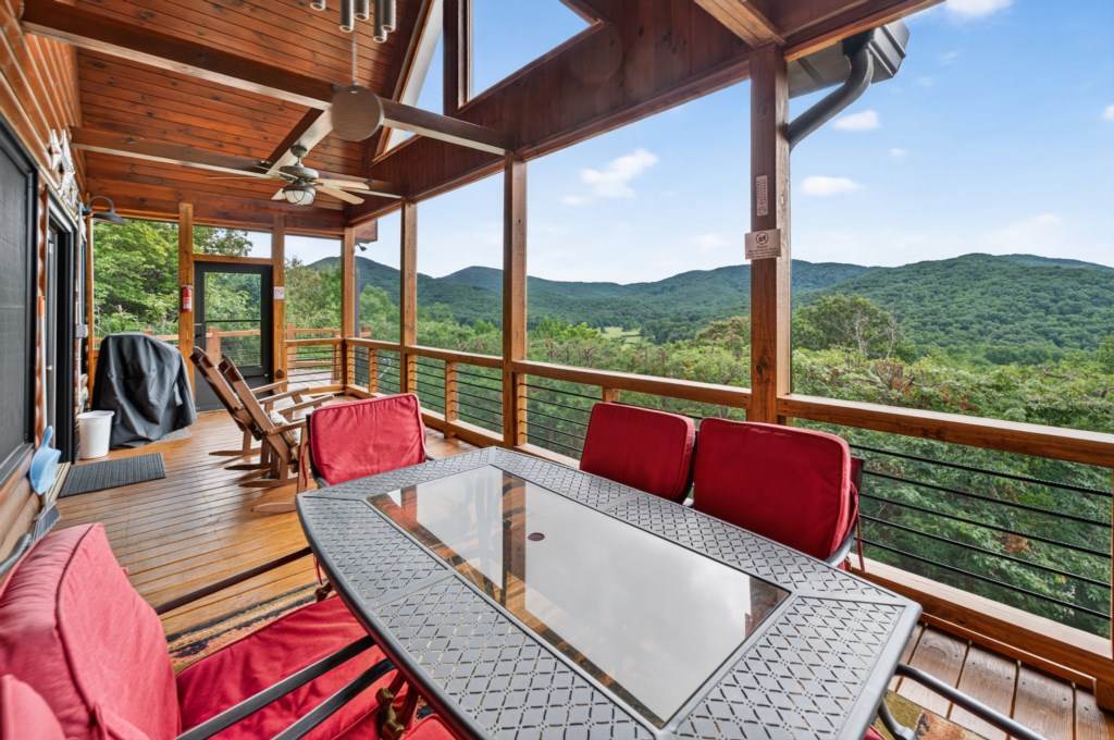 Spacious deck with mountain views, perfect for outdoor dining and relaxation.