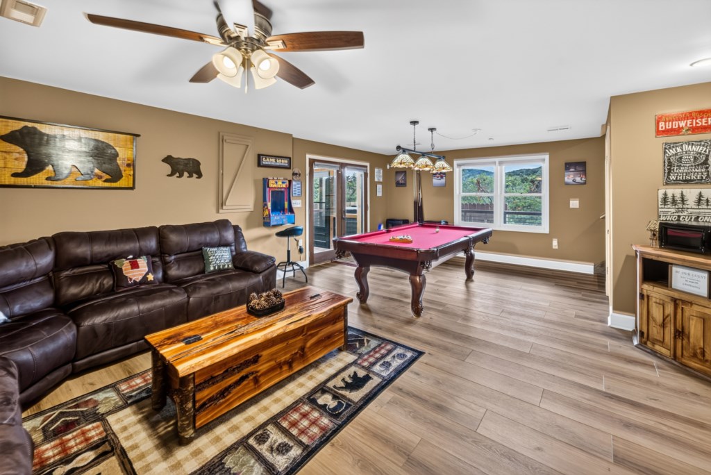 Rustic game room with pool table and cozy seating for fun-filled evenings.