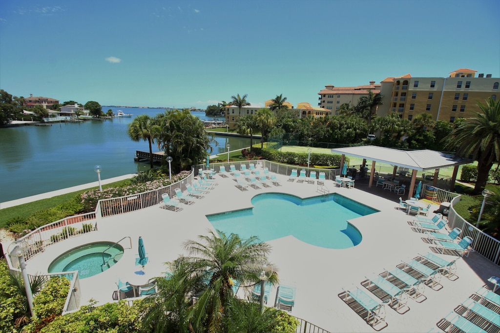 View of the pool and tennis/pickleball courts from the balcony