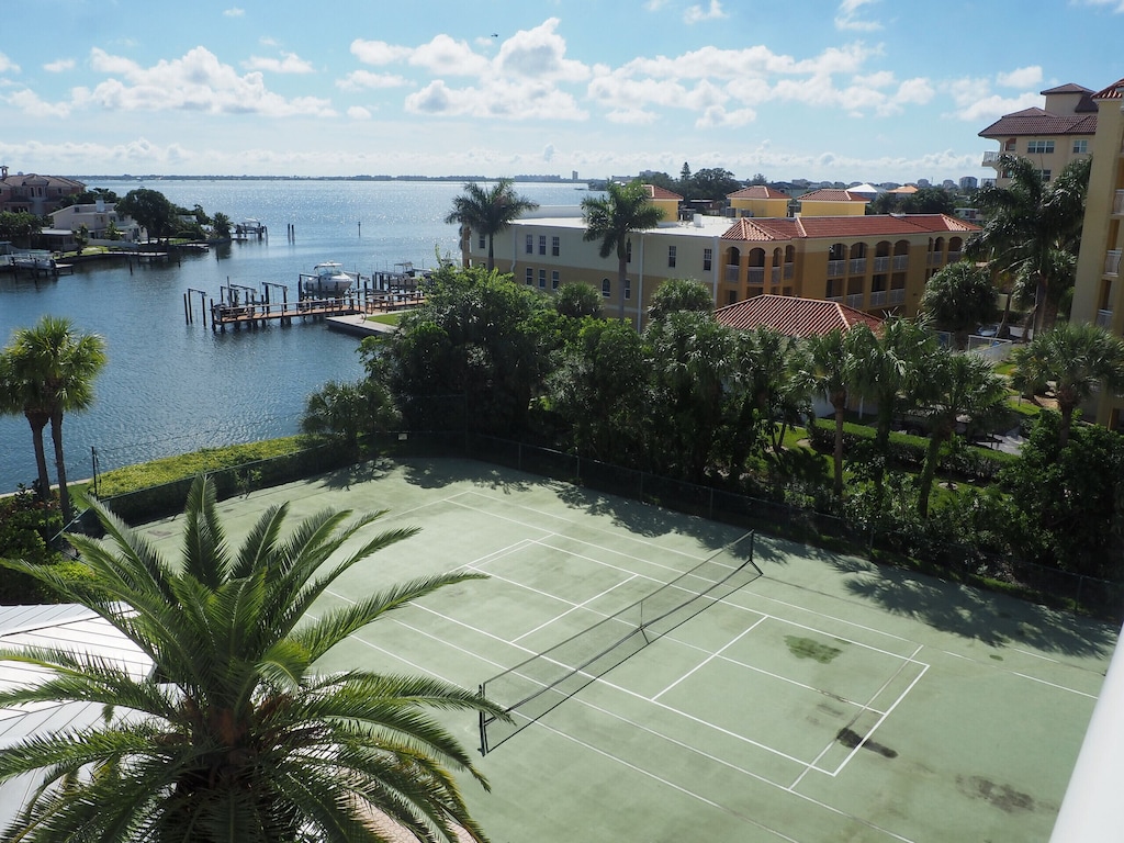 View of the tennis and pickle ball courts with a shuffleboard court adjacent to the tennis court