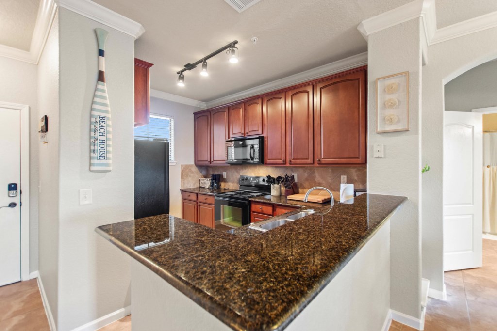 Fully-equipped kitchen with granite contertops