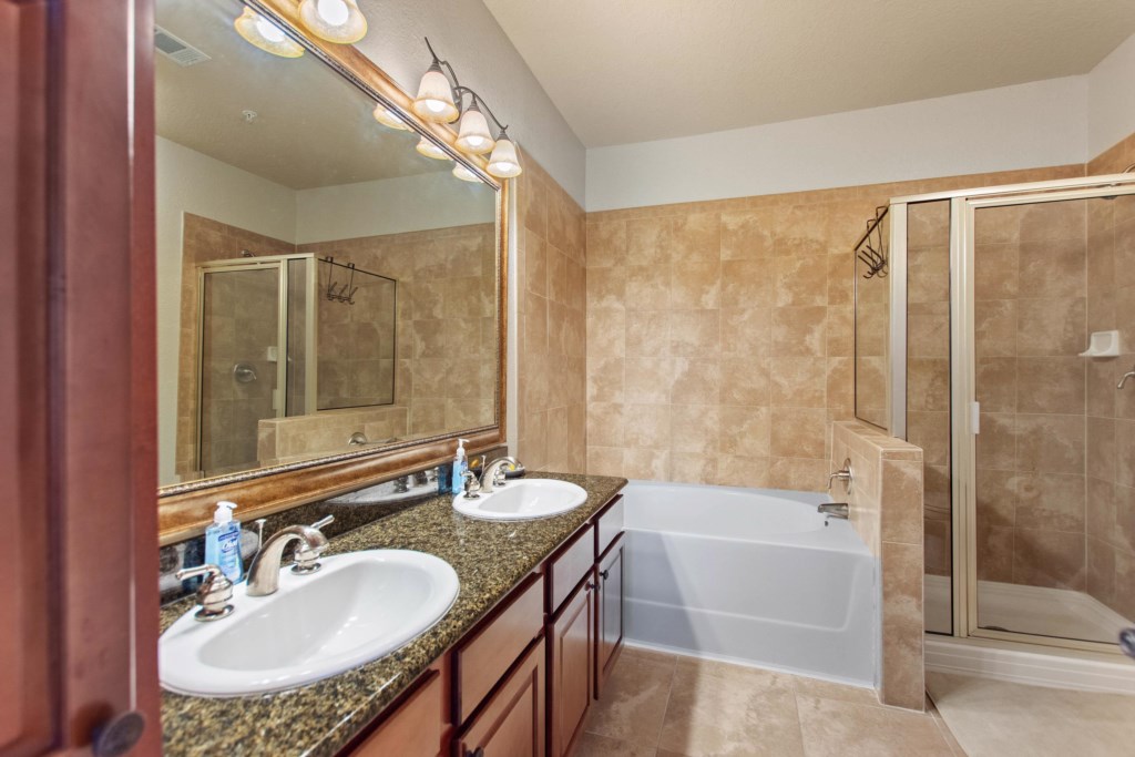 En suite bathroom double sink with wide vanity mirror