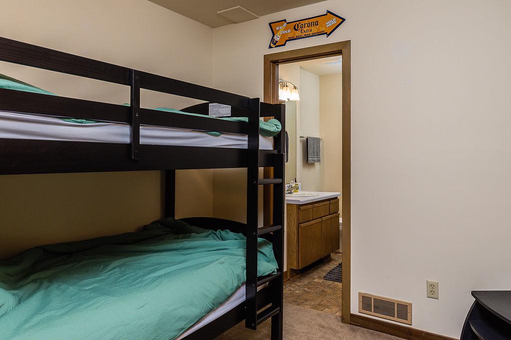 Extra bunk room with twin bunks with private full bath. 